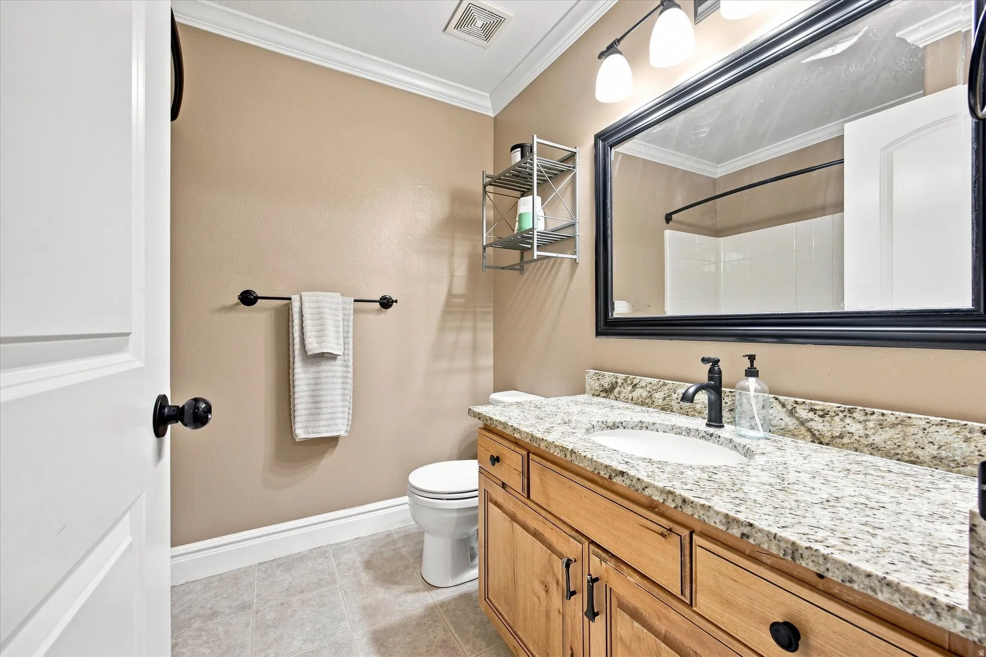 Granite countertop with undermount sink and matte black faucet