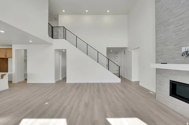 Light wood-finish flooring with a multi-story ceiling
