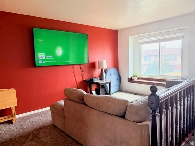 Built-in window seat, wood-finish railing, and wall-mounted television