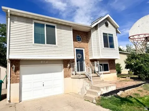 Brick and siding exterior with a two-car garage