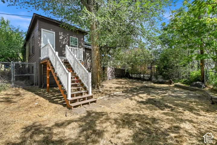 Exterior building with wood siding and a white door
