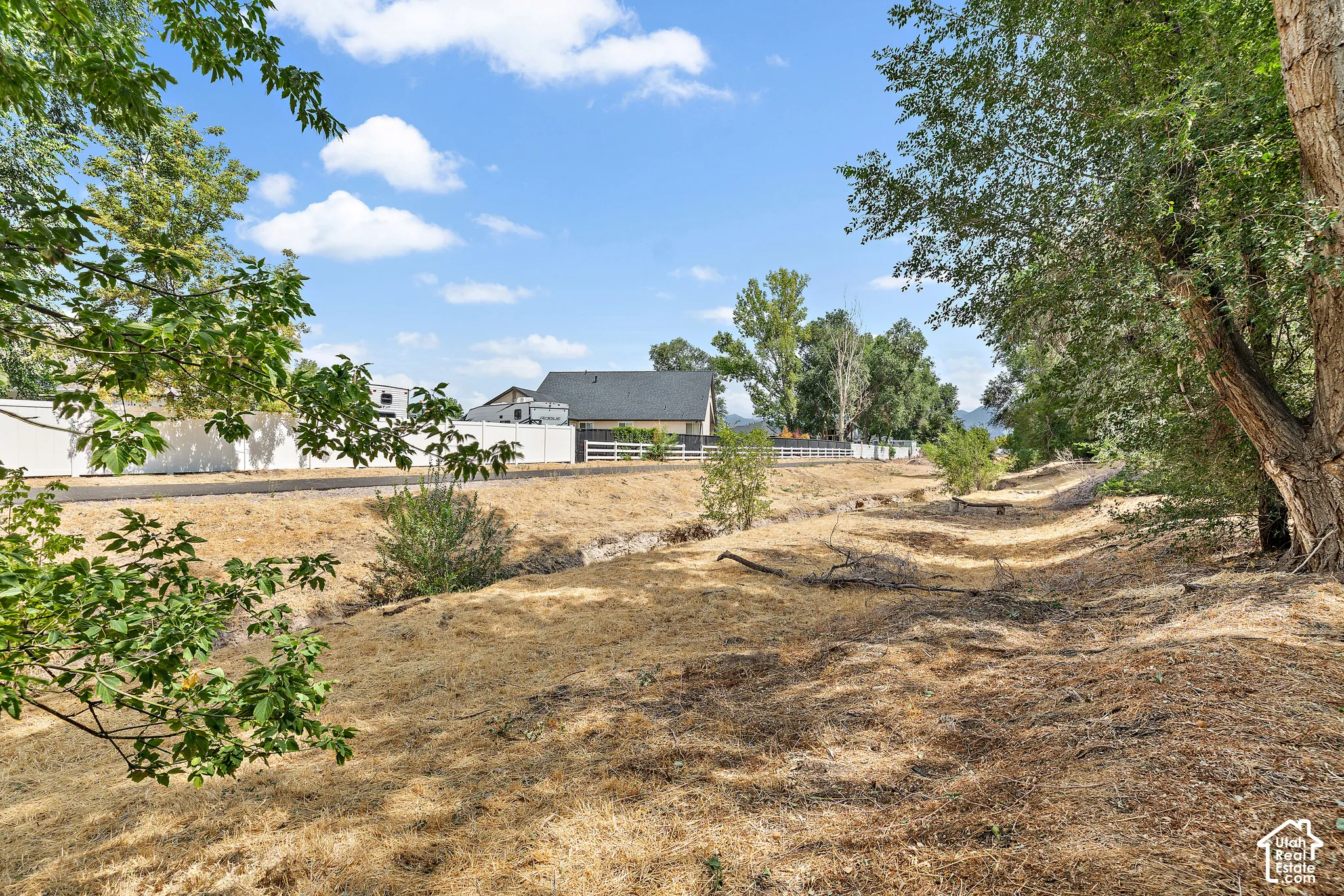 Midas Creek behind property, maintained by city