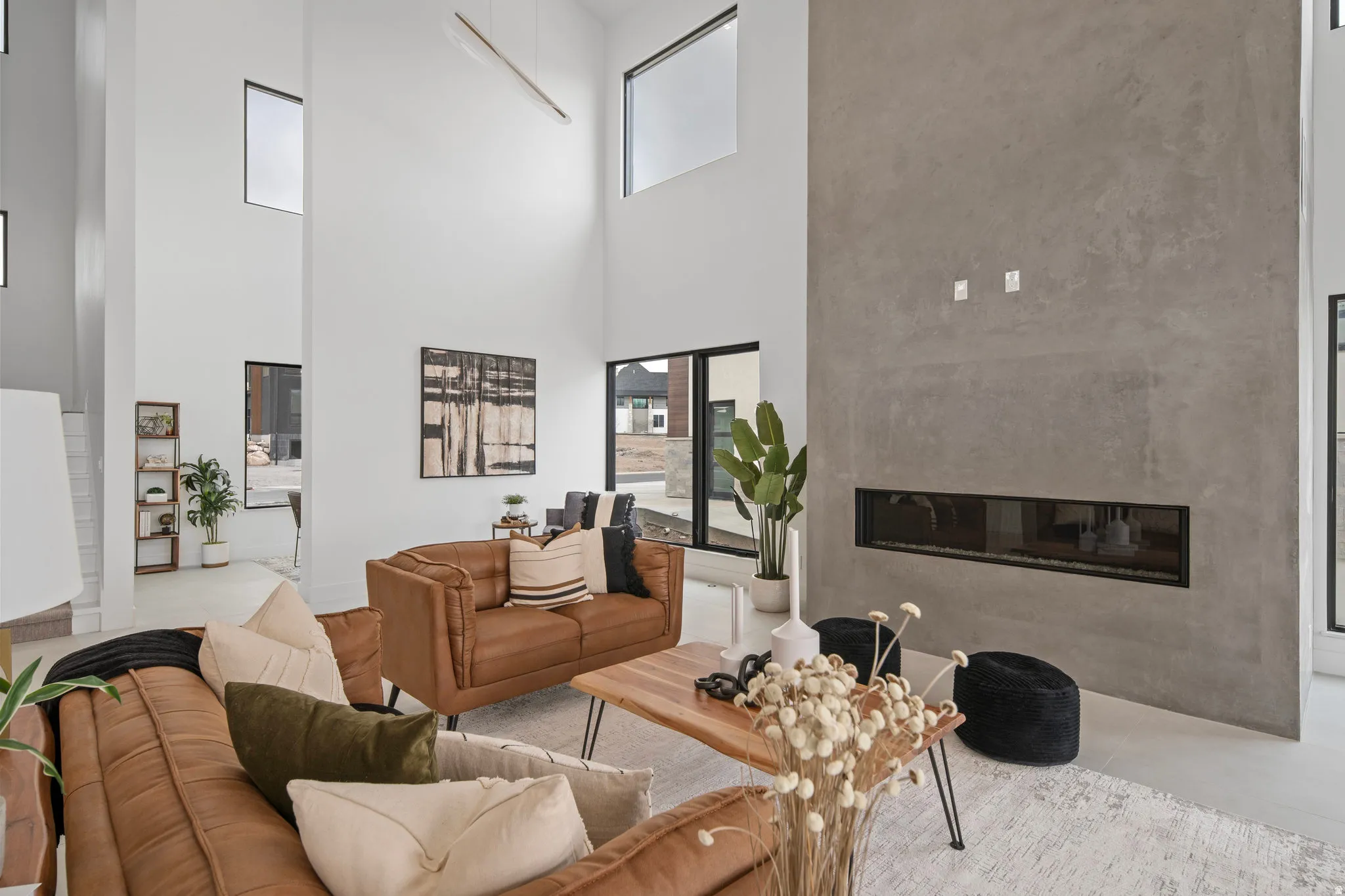 Soaring two-story ceilings with expansive windows