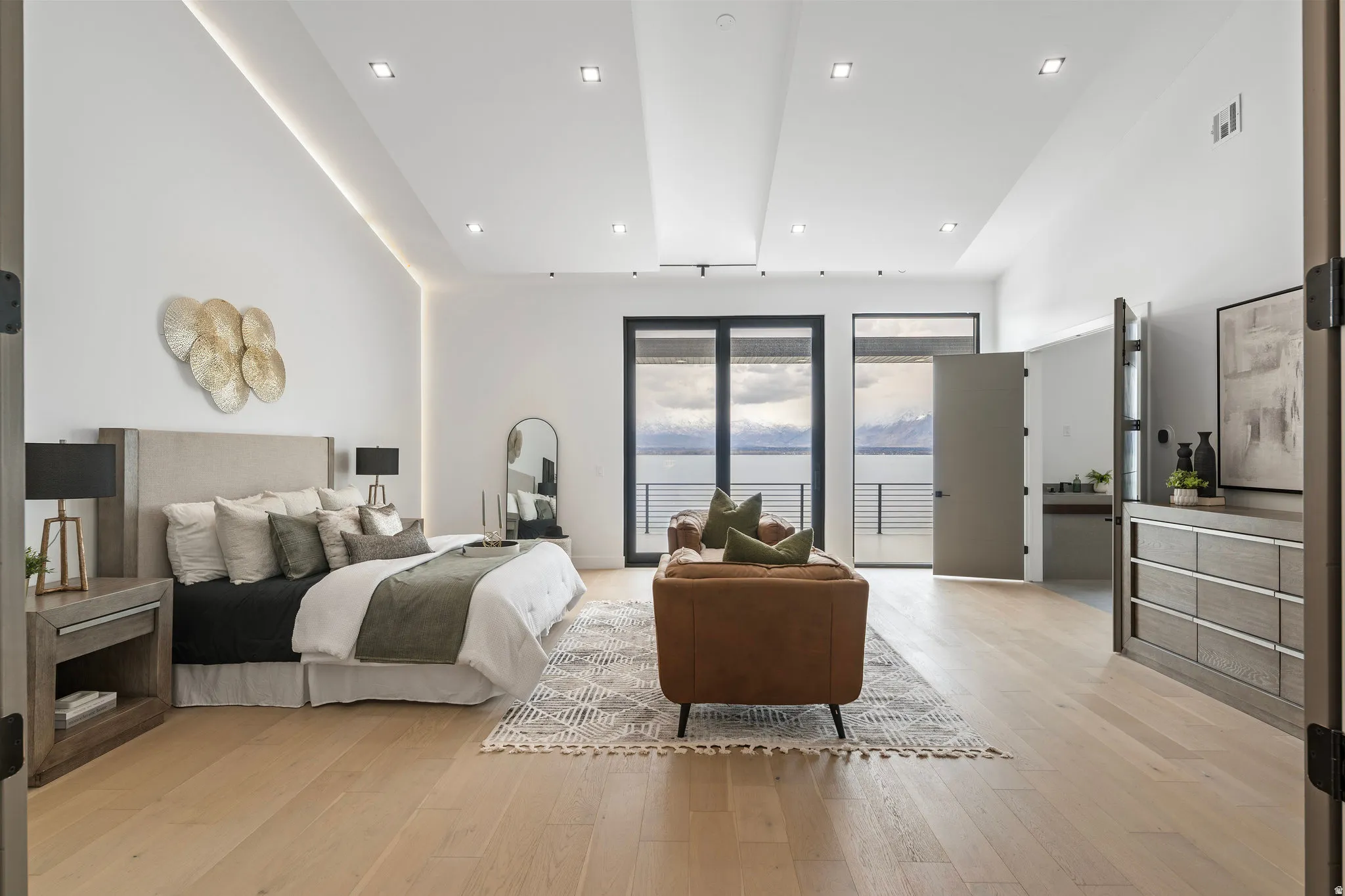 Recessed lighting and cove lighting illuminate high vaulted ceilings