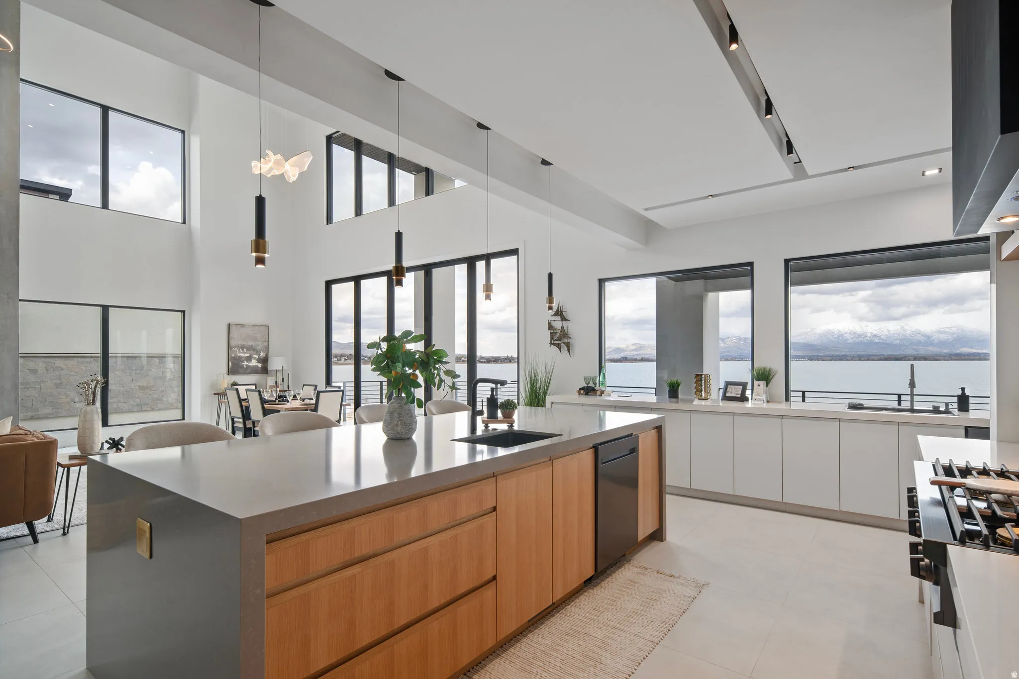 Sleek kitchen island with integrated sink, stainless steel appliances, and wood-finish cabinetry