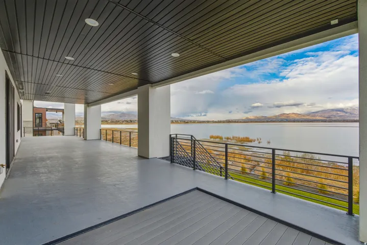 Expansive covered patio with a textured ceiling and recessed lighting