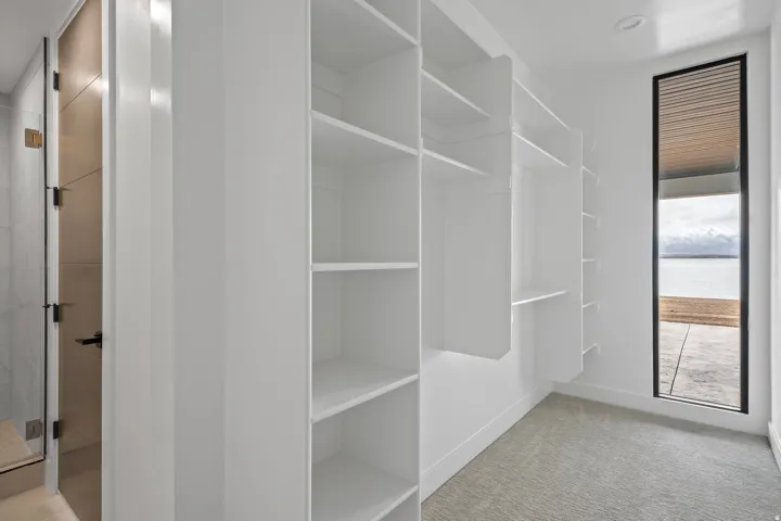 Extensive built-in shelving and hanging rods