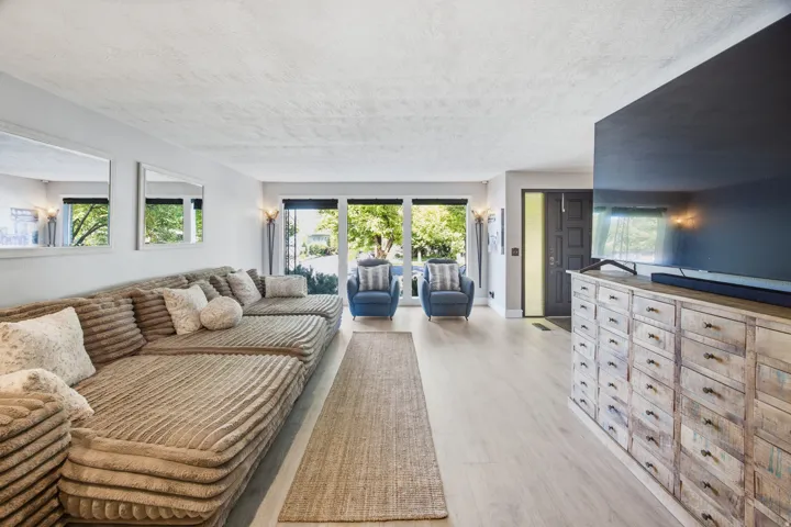 Wide plank wood-finish flooring throughout