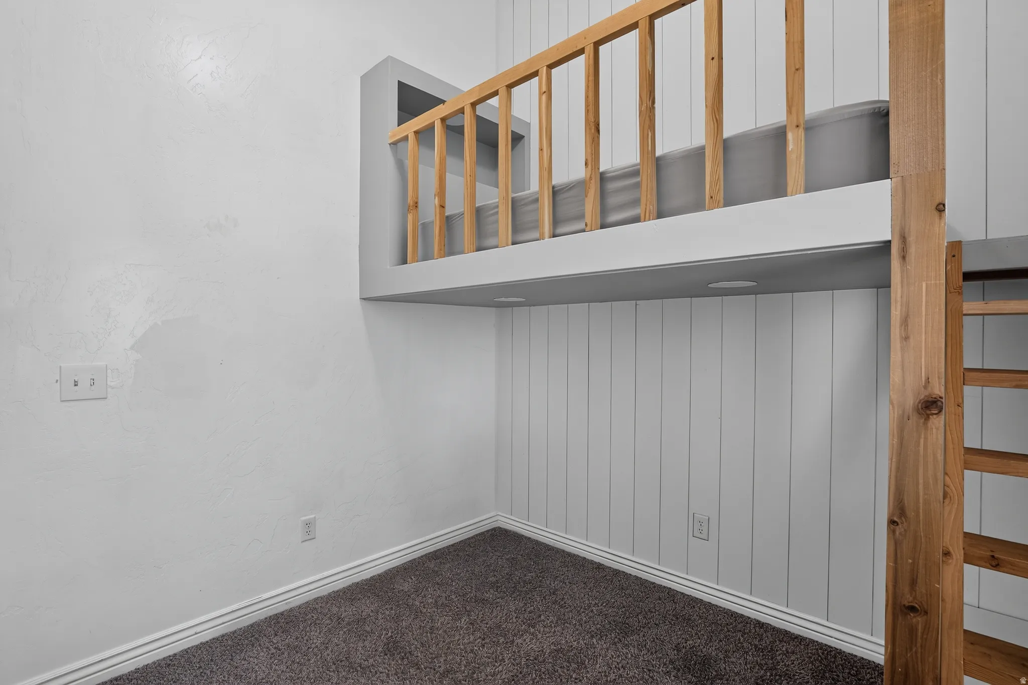 Bedroom 3 - Built-in loft bed with natural wood railing and ladder