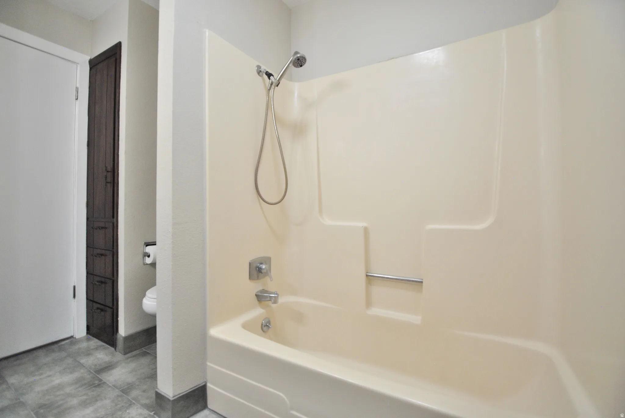 Integrated tub and shower combination with chrome fixtures