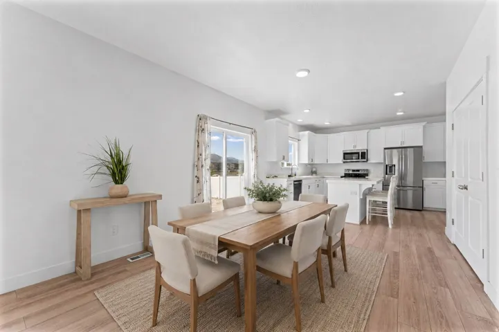 Open-concept living area with wood-finish flooring