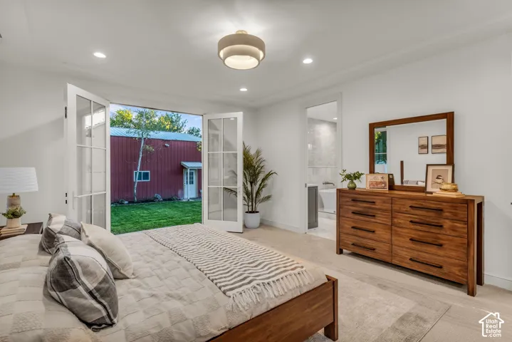 White French doors opening to an exterior, recessed lighting, and a contemporary semi-flush mount ceiling fixture
