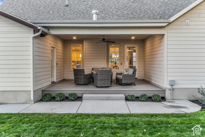 Covered outdoor patio with composite decking and recessed lighting