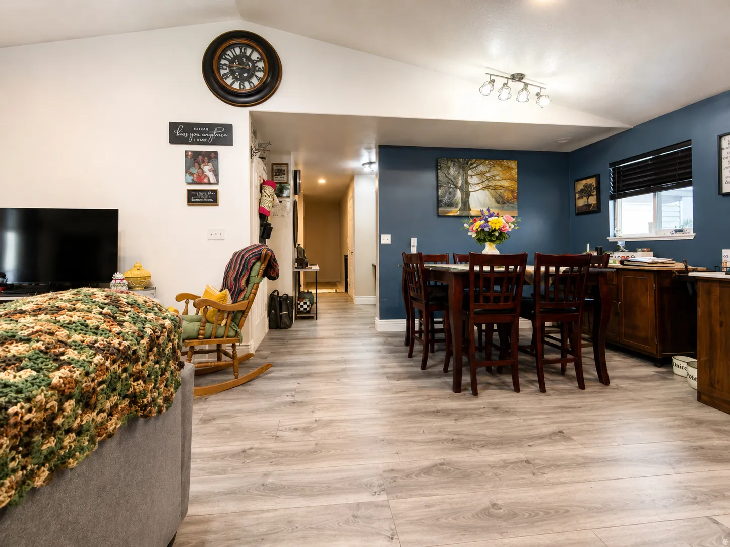 Vaulted ceiling, recessed lighting, accent wall, track lighting fixture