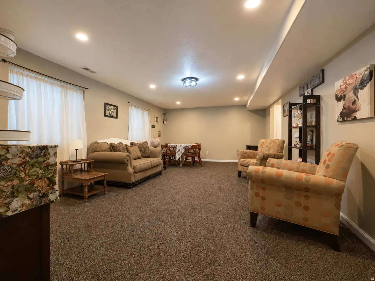 Recessed lighting, carpeted flooring, neutral wall tones, and white trim