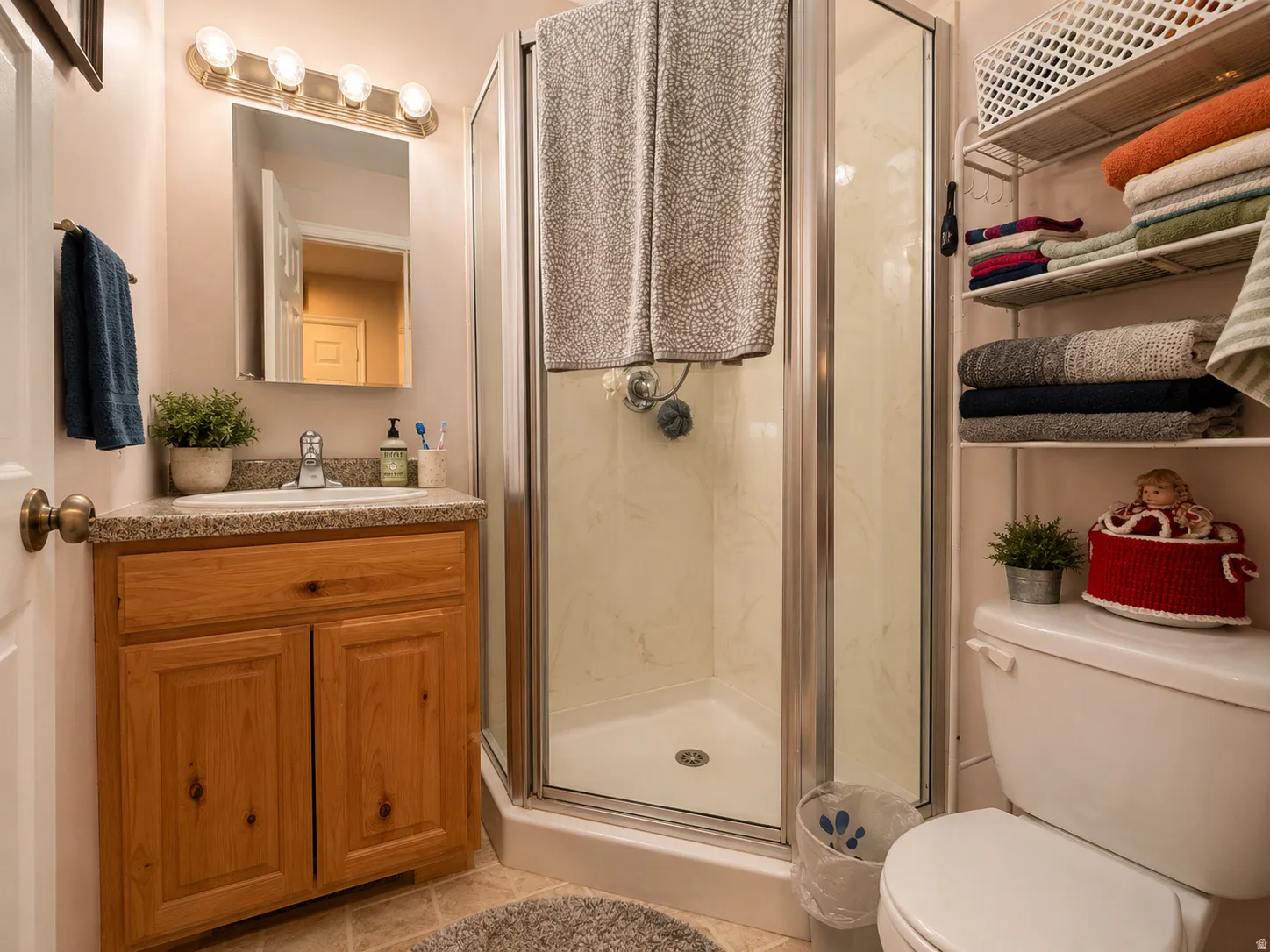 Corner shower enclosure with clear glass door