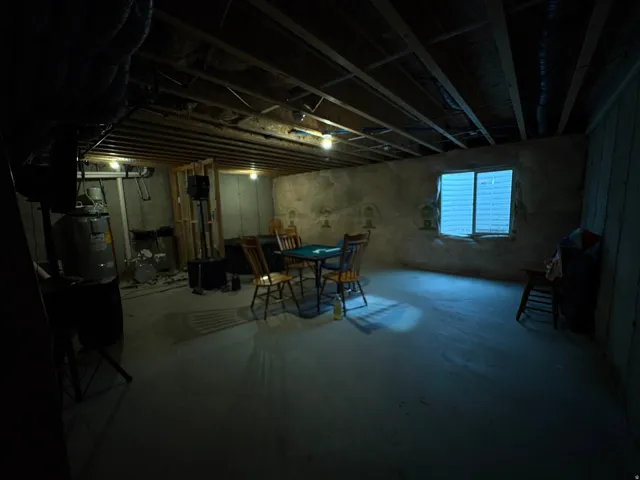 Exposed ceiling joists and concrete flooring