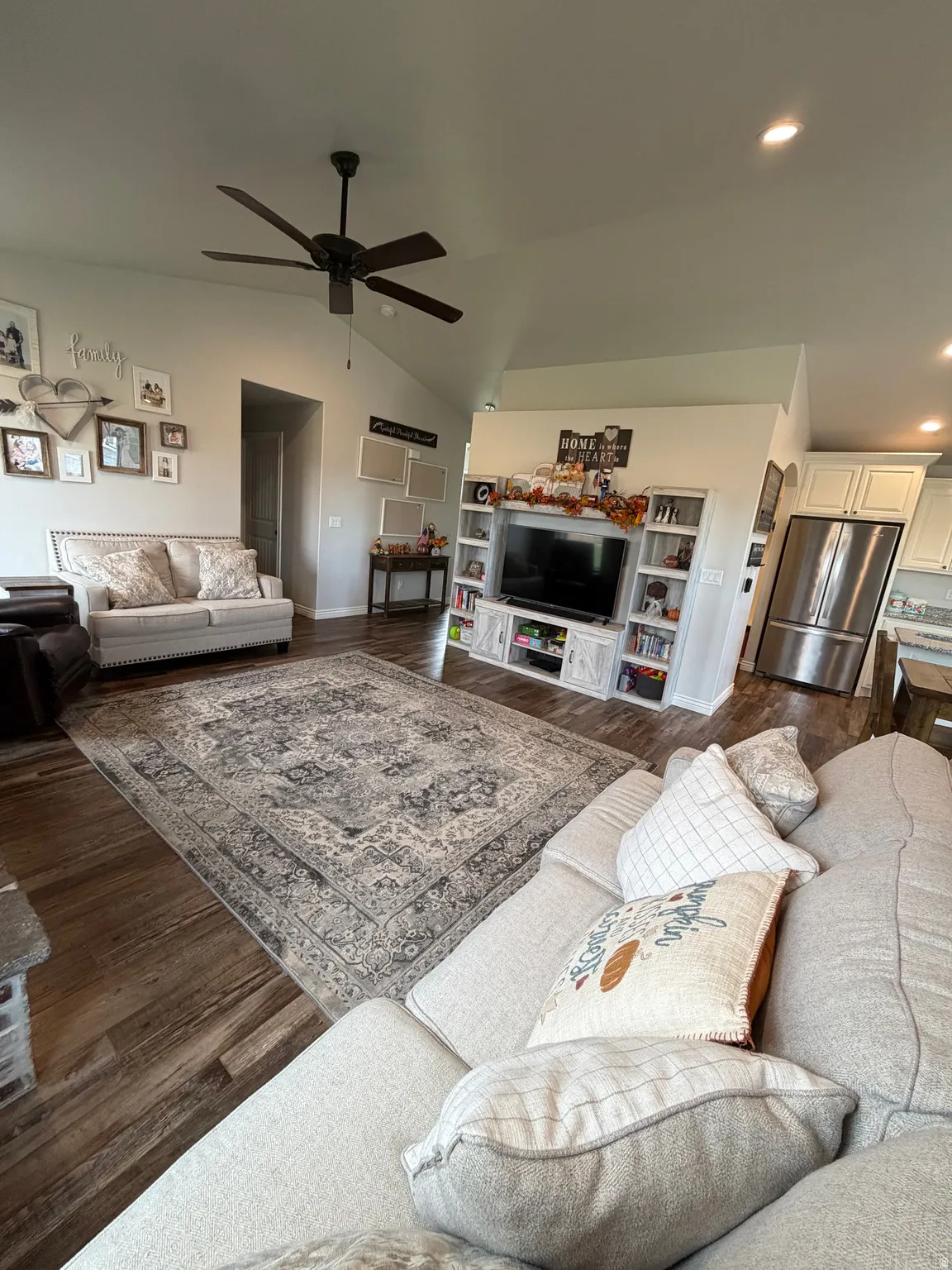 Main Level Great Room with vaulted ceilings ceiling fan, LVP flooring, recessed lighting