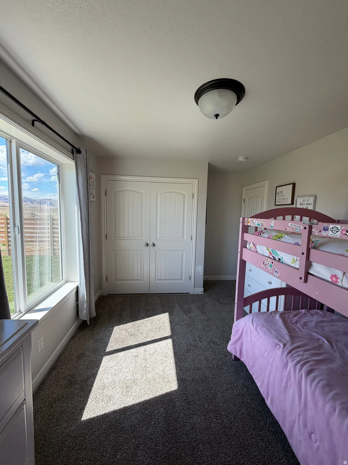 Bedroom 2: Large double closet doors, with built in organizer, large window with amazing views!