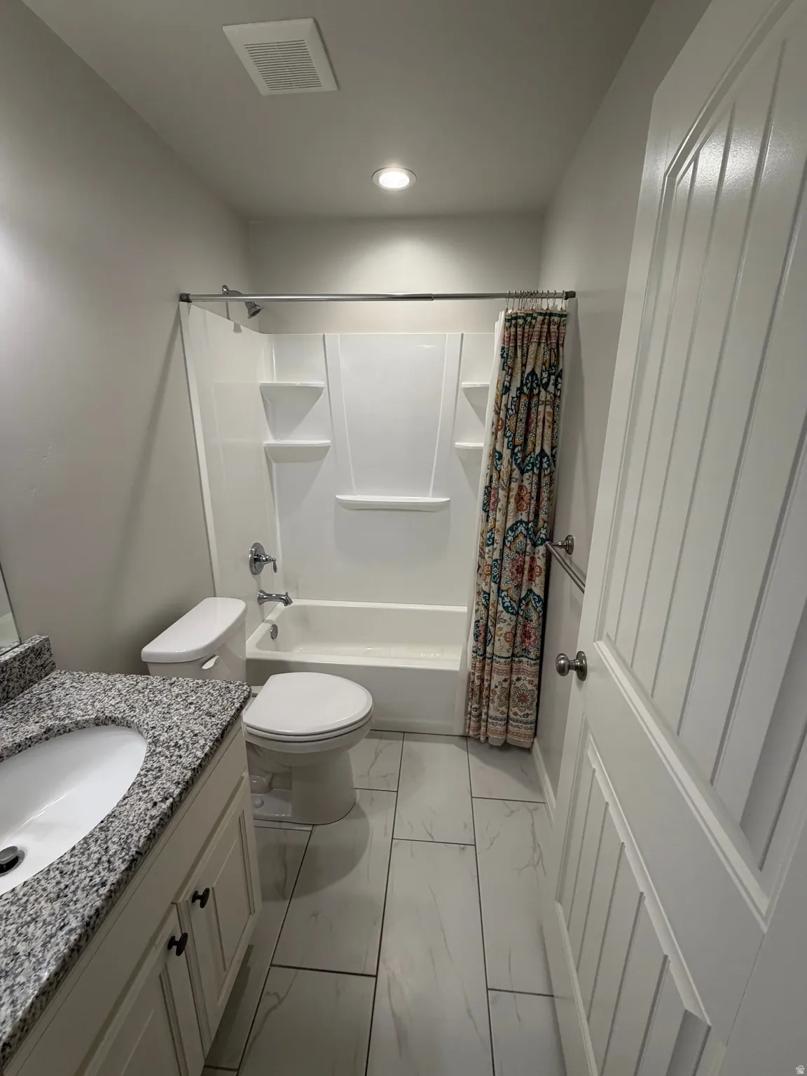 Main Floor Bathroom : shower surround with built in shelving.