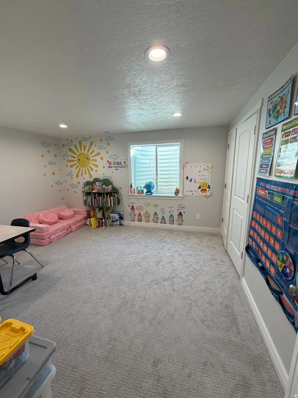 Bedroom 4: Large basement Bedroom  with large double closet doors and plush carpet flooring.