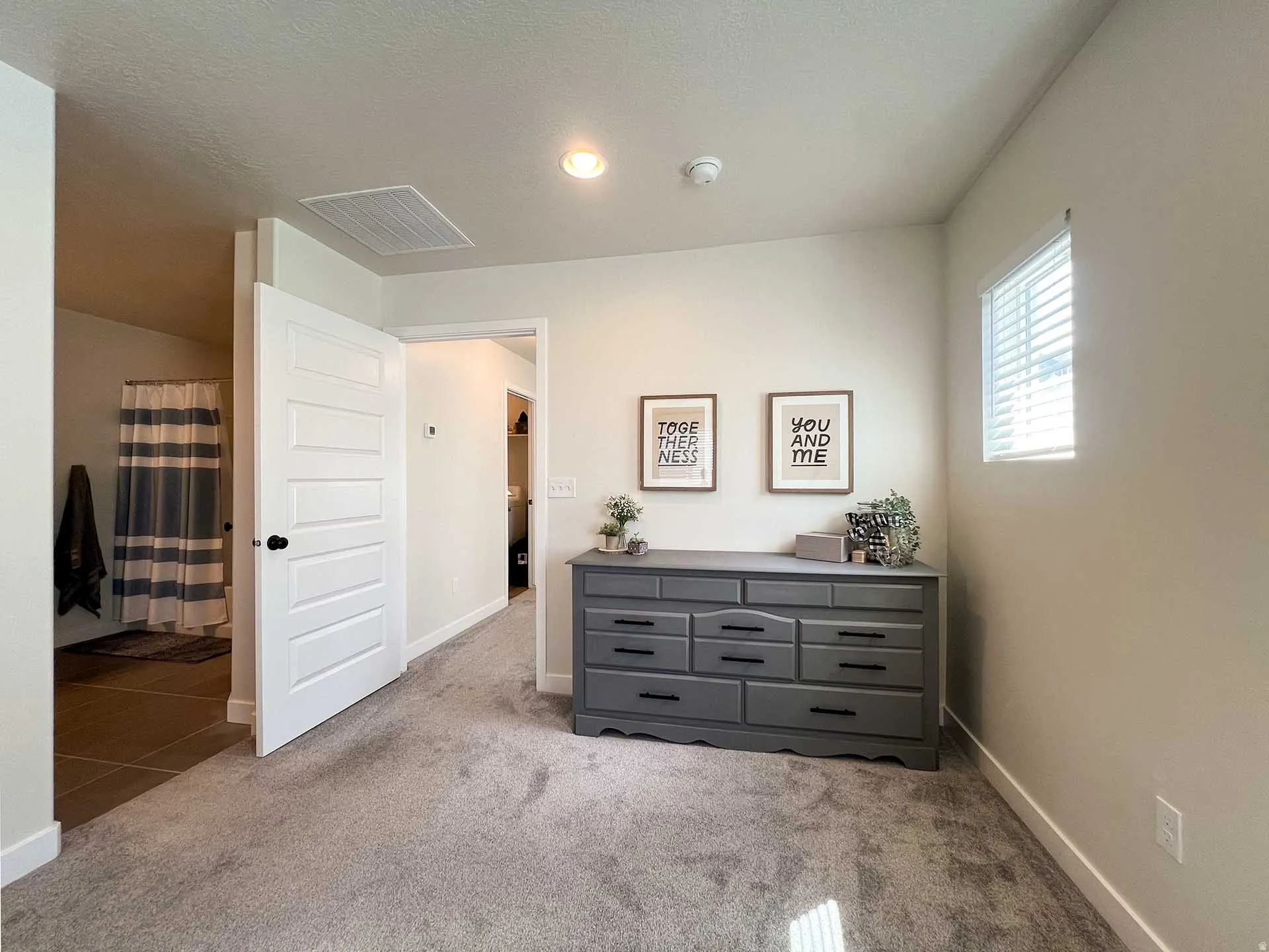 Carpeted flooring, recessed lighting, white trim, and a window with blinds