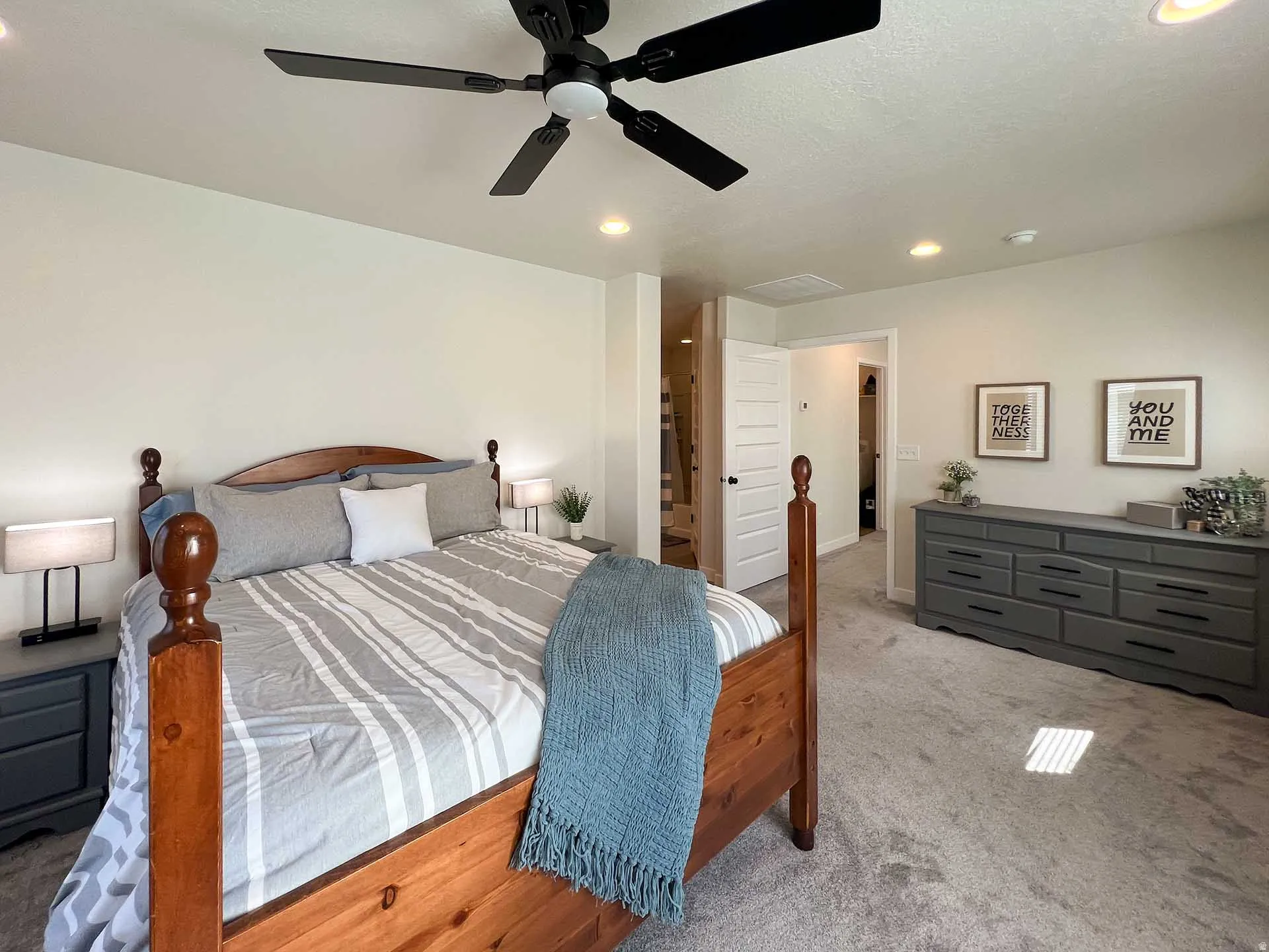 Recessed lighting, ceiling fan, and light-colored wall paint