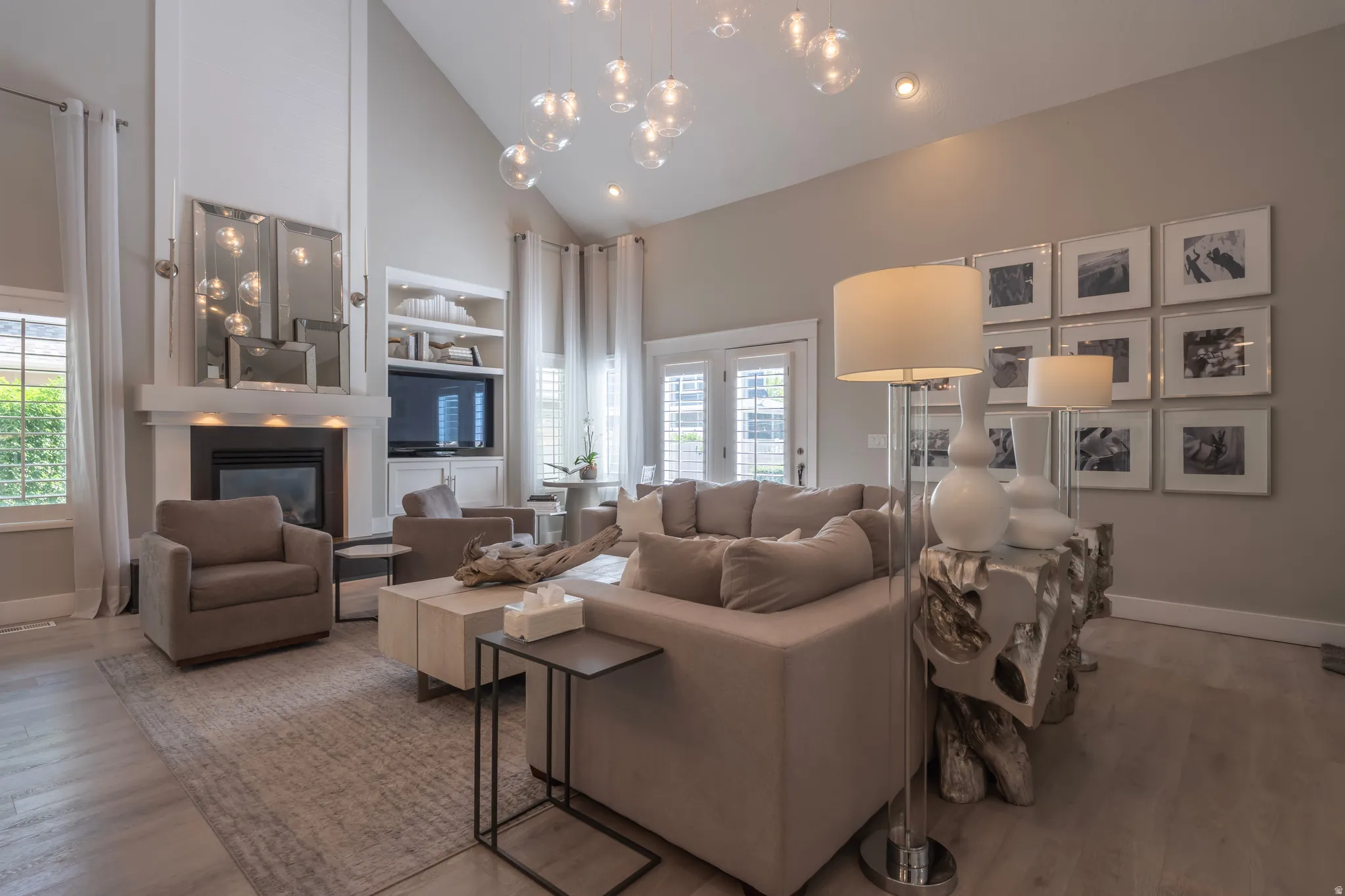 Vaulted ceiling with suspended glass orb light fixtures