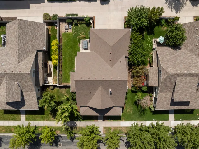 This is the only home on the street situated closer to the front of the lot. That makes the driveway in the back able to fit more cars (more on that later)