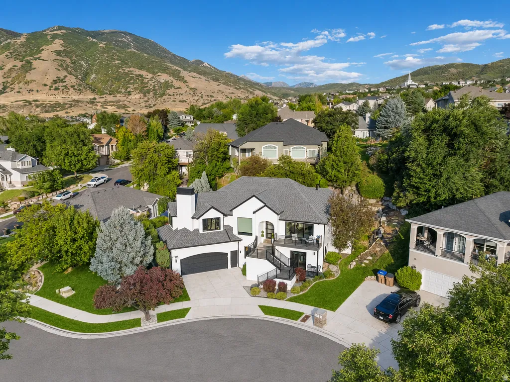 Modern two-story residence with a black and white exterior and attached garage