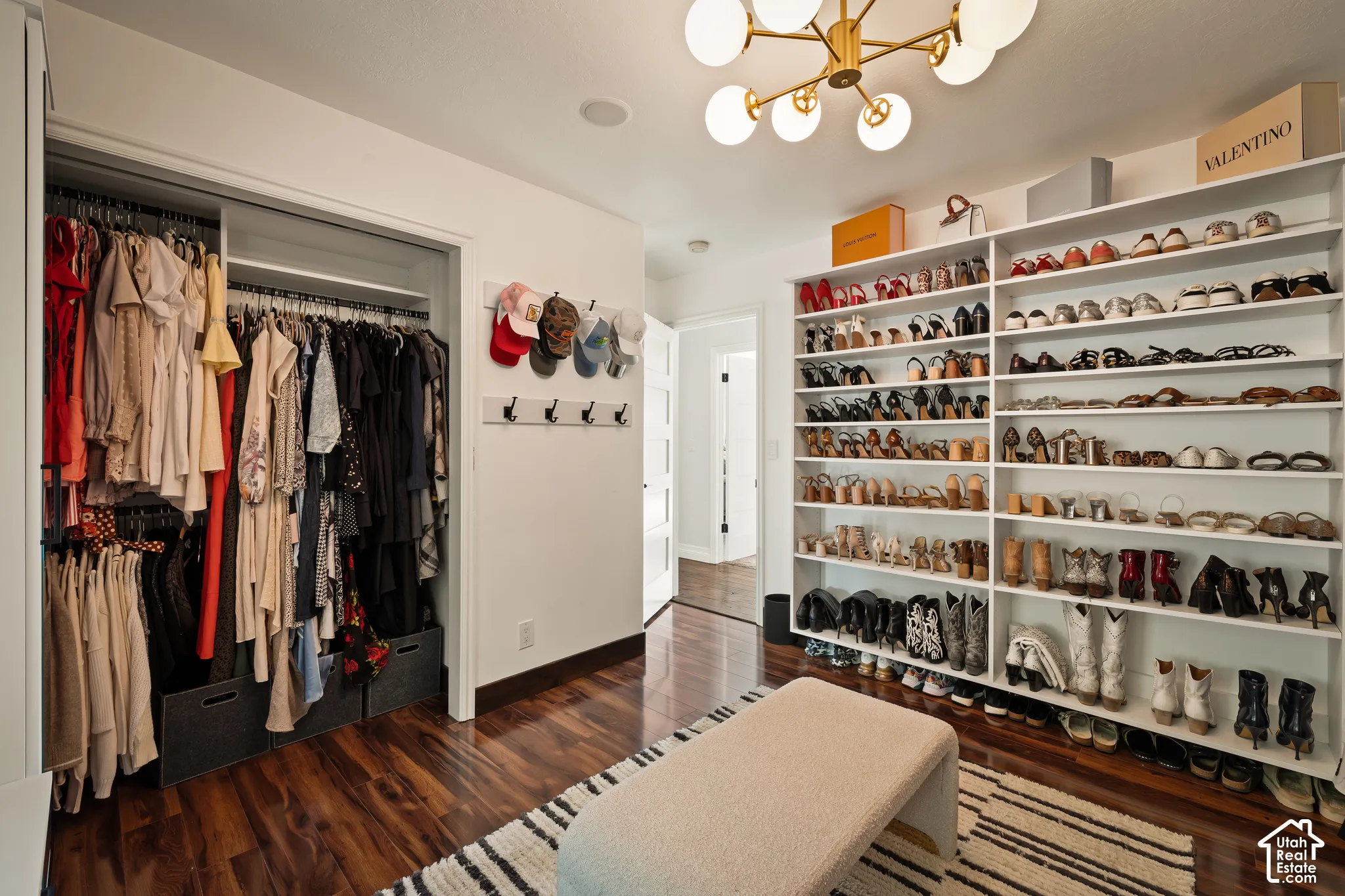 Recessed lighting, wood-finish flooring, built-in shelving, and a modern ceiling light fixture