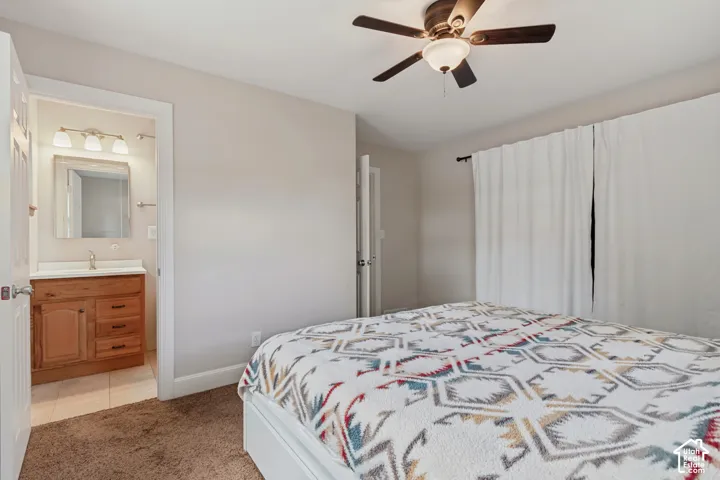 Warm-toned wall paint with a ceiling fan and plush carpet