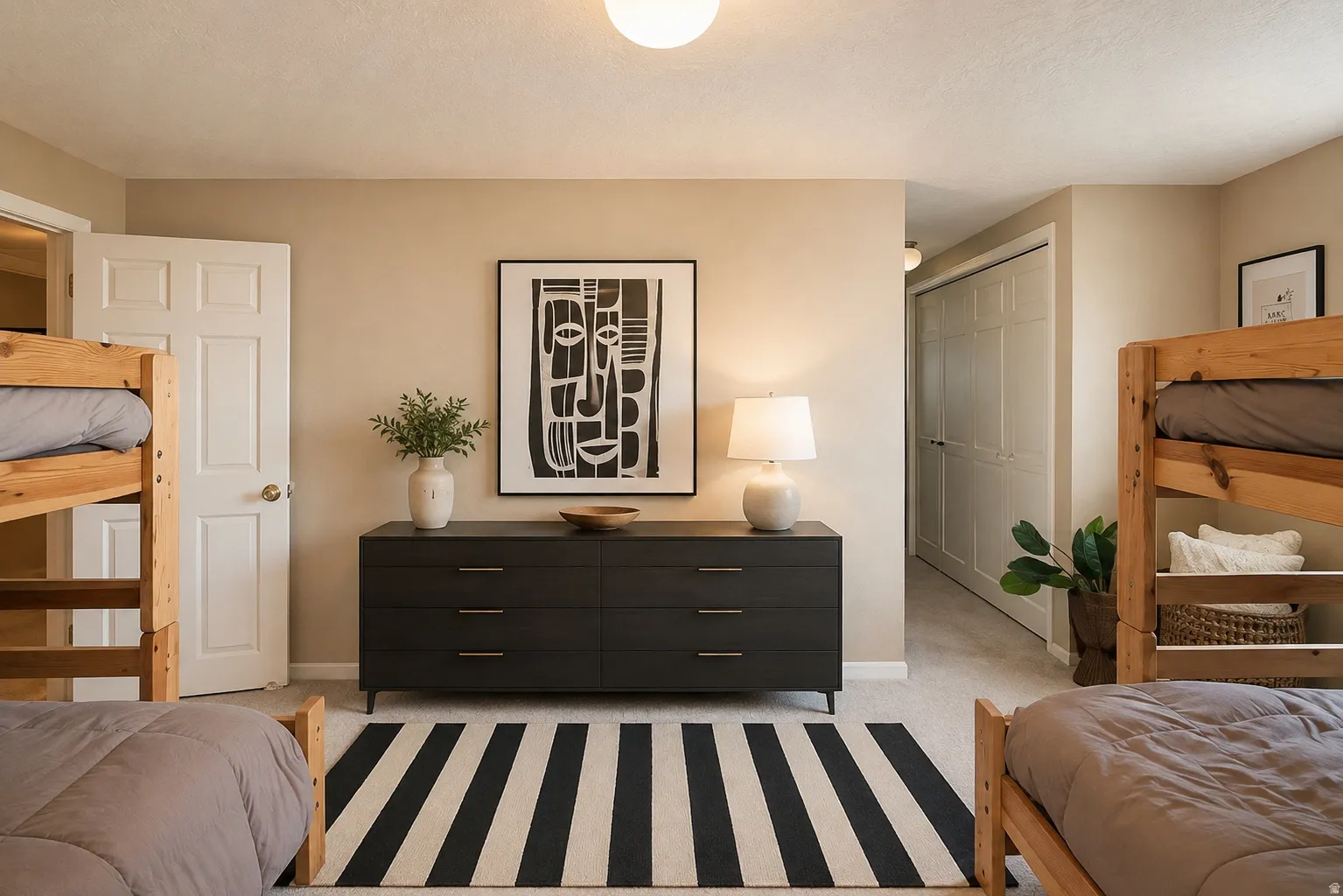 Carpeted flooring throughout, neutral wall tones, and a paneled interior door