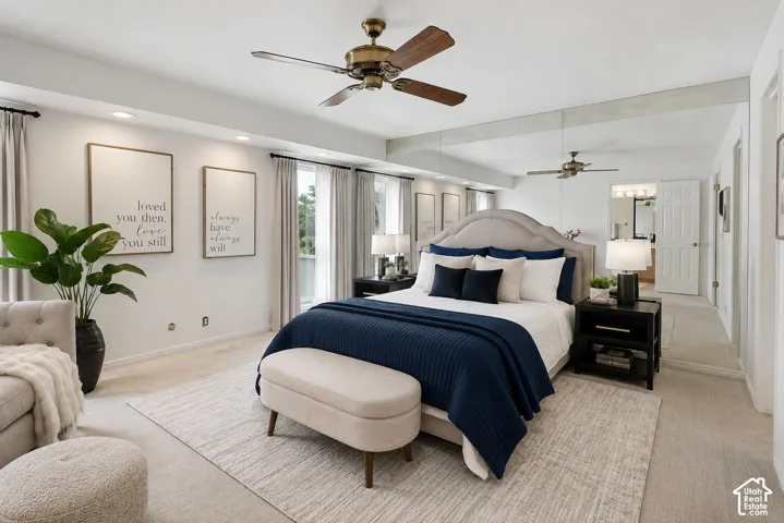 Recessed lighting, ceiling fan with light, upholstered bed frame, full-height wall mirrors, and double windows with curtain rods