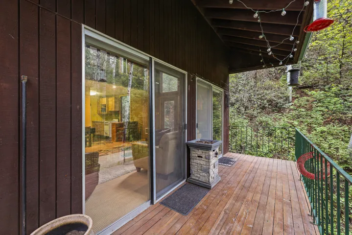 Double sliding glass doors leading to the walk around deck