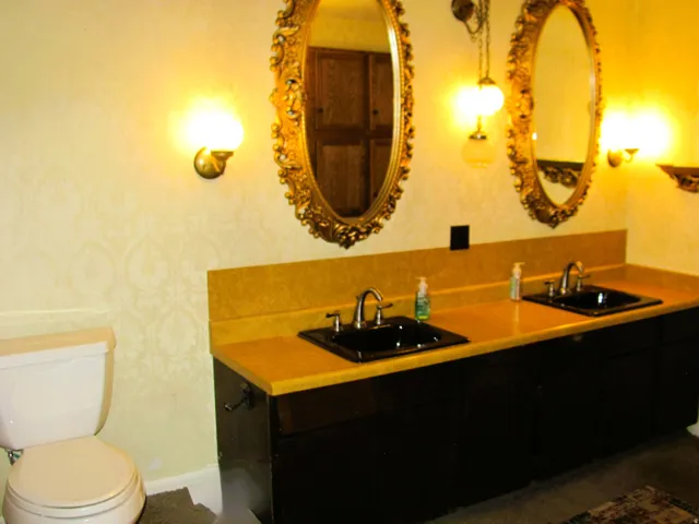 Double vanity with black sinks and chrome fixtures