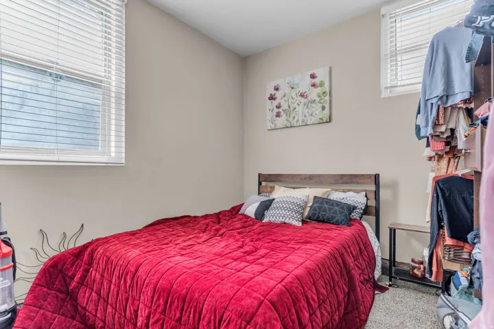 Light-toned walls with carpeted flooring