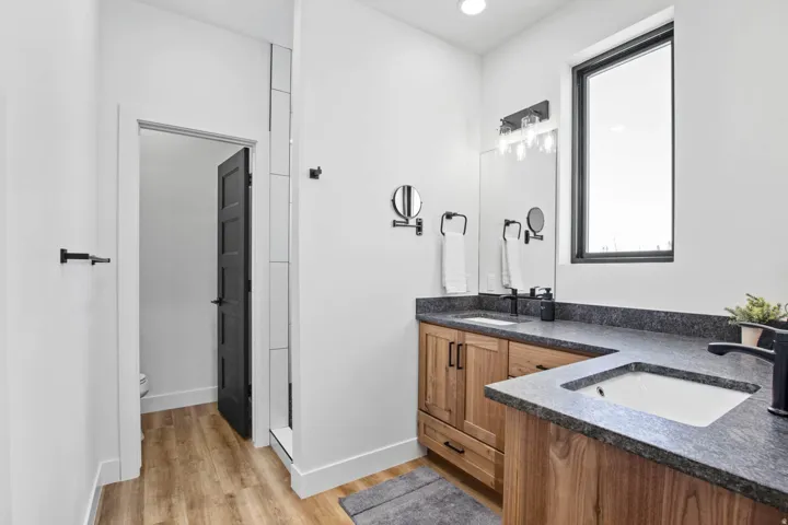 Dual vanity with stone countertops and undermount sinks