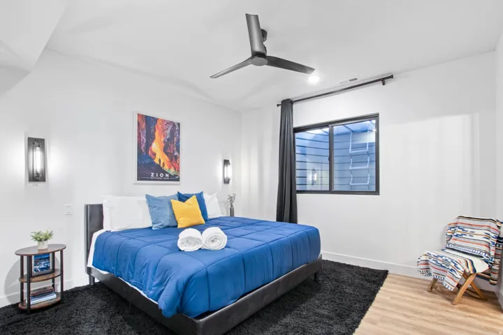 Recessed lighting, wood-finish flooring, and a modern ceiling fan