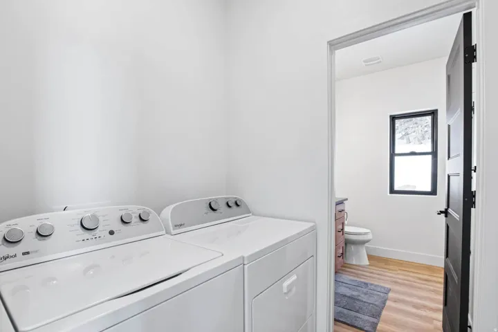 Laundry appliances and light wood-finish flooring
