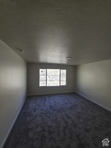 Recessed lighting fixtures complement the ceiling texture