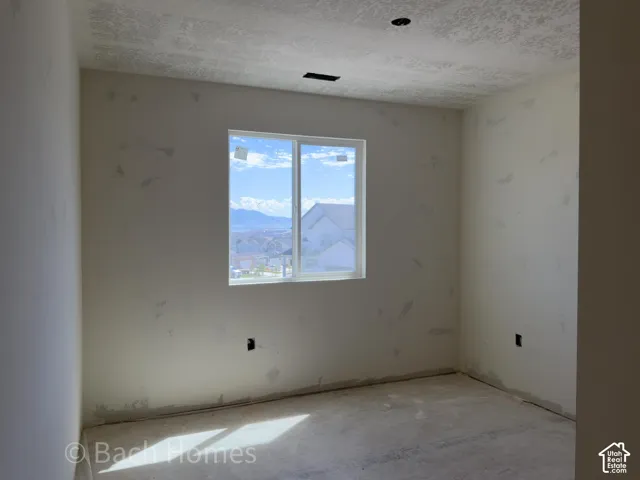 Recessed lighting, singular window, mountain backdrop