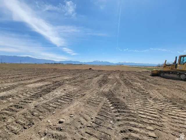 Cleared parcel of land with visible tire tracks
