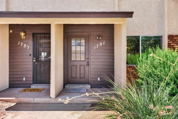 Stucco exterior with brick accents and covered entryways