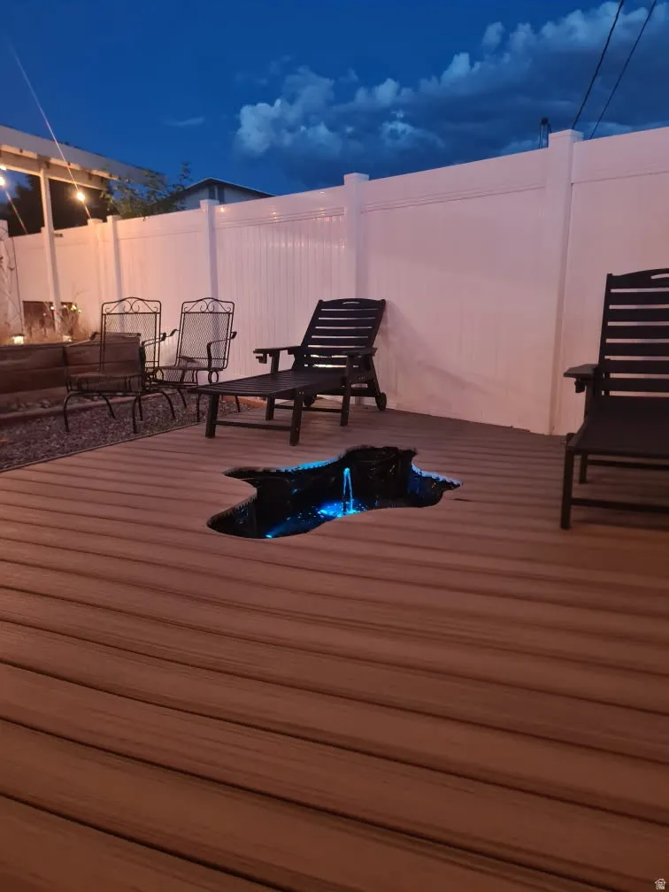 Brown composite decking with an integrated water feature