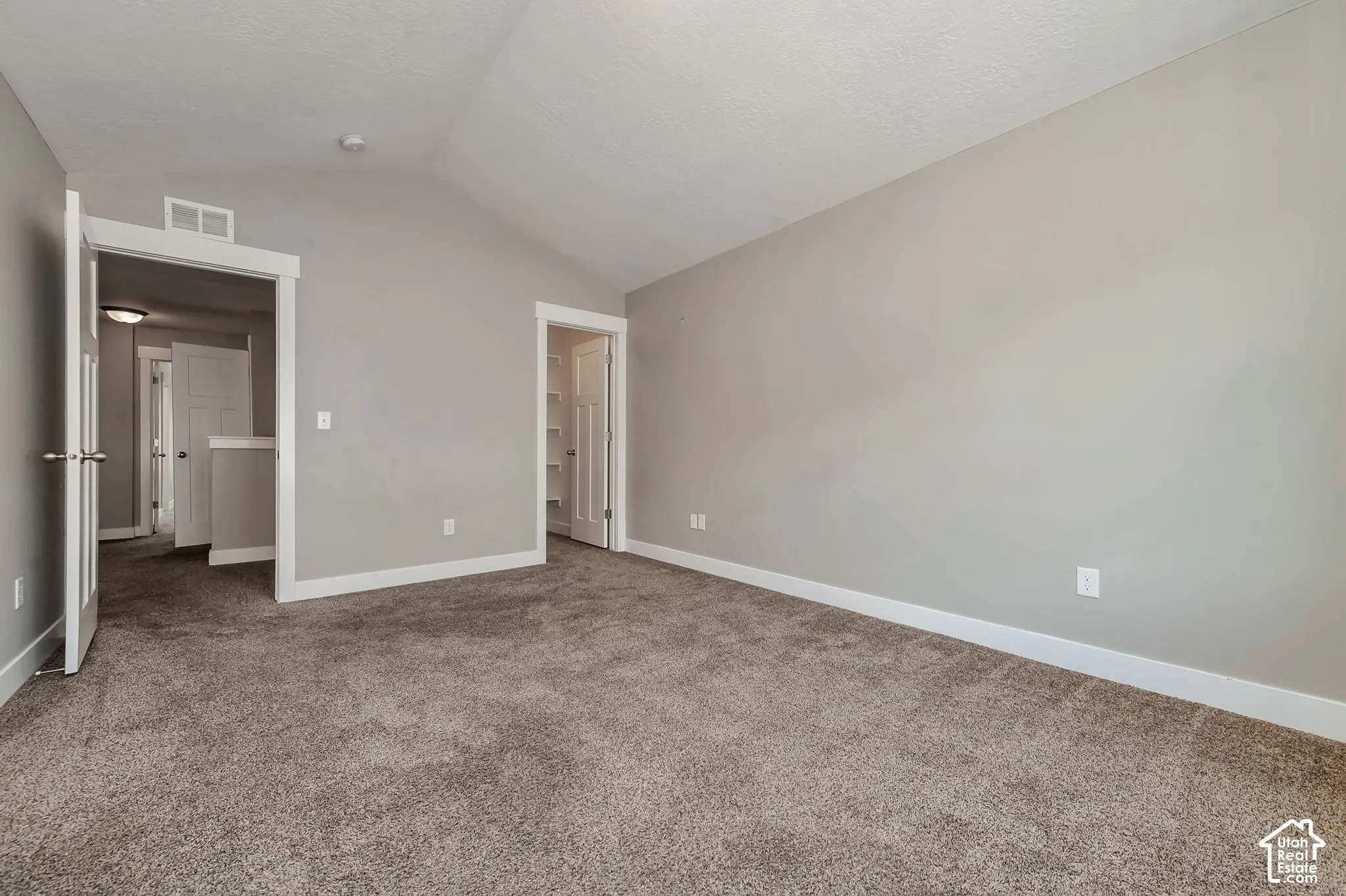 Vaulted ceiling and neutral gray wall tones