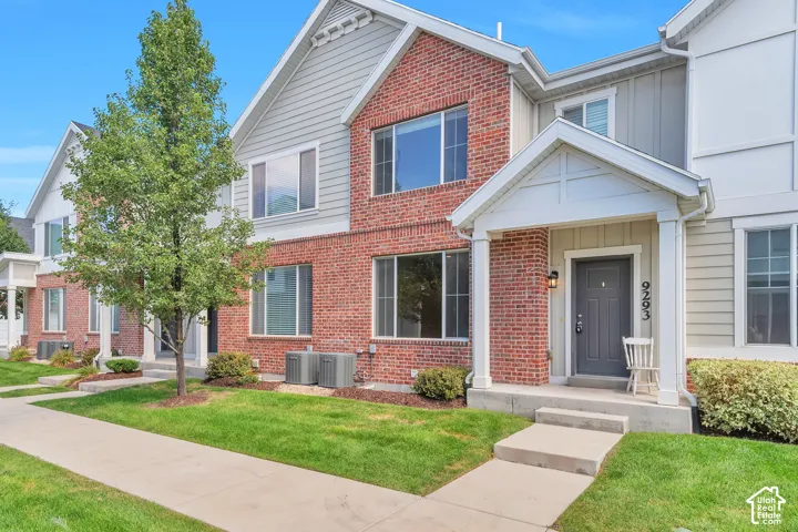 Brick and siding exterior with a covered entry