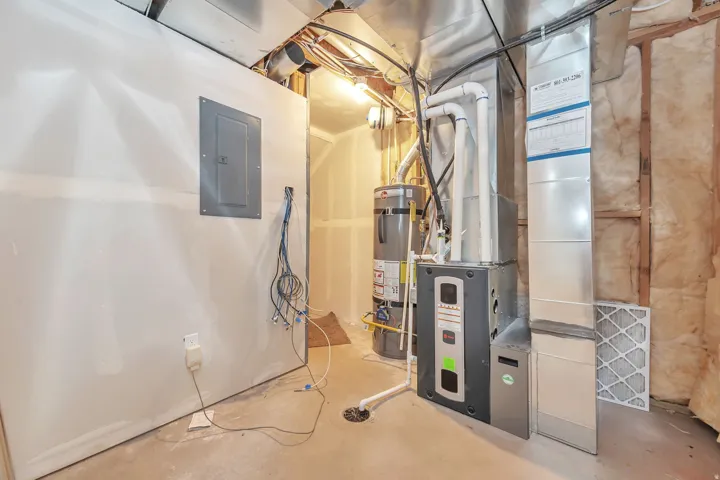Furnace system, water heater, exposed ductwork, and electrical panel