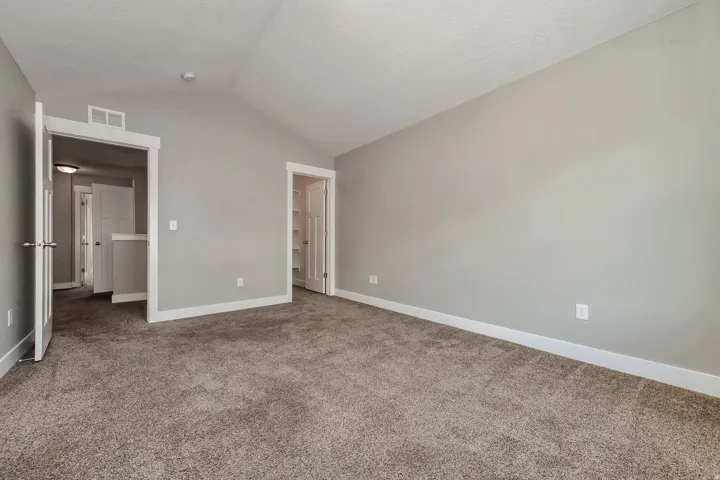 Vaulted ceiling and neutral gray wall tones
