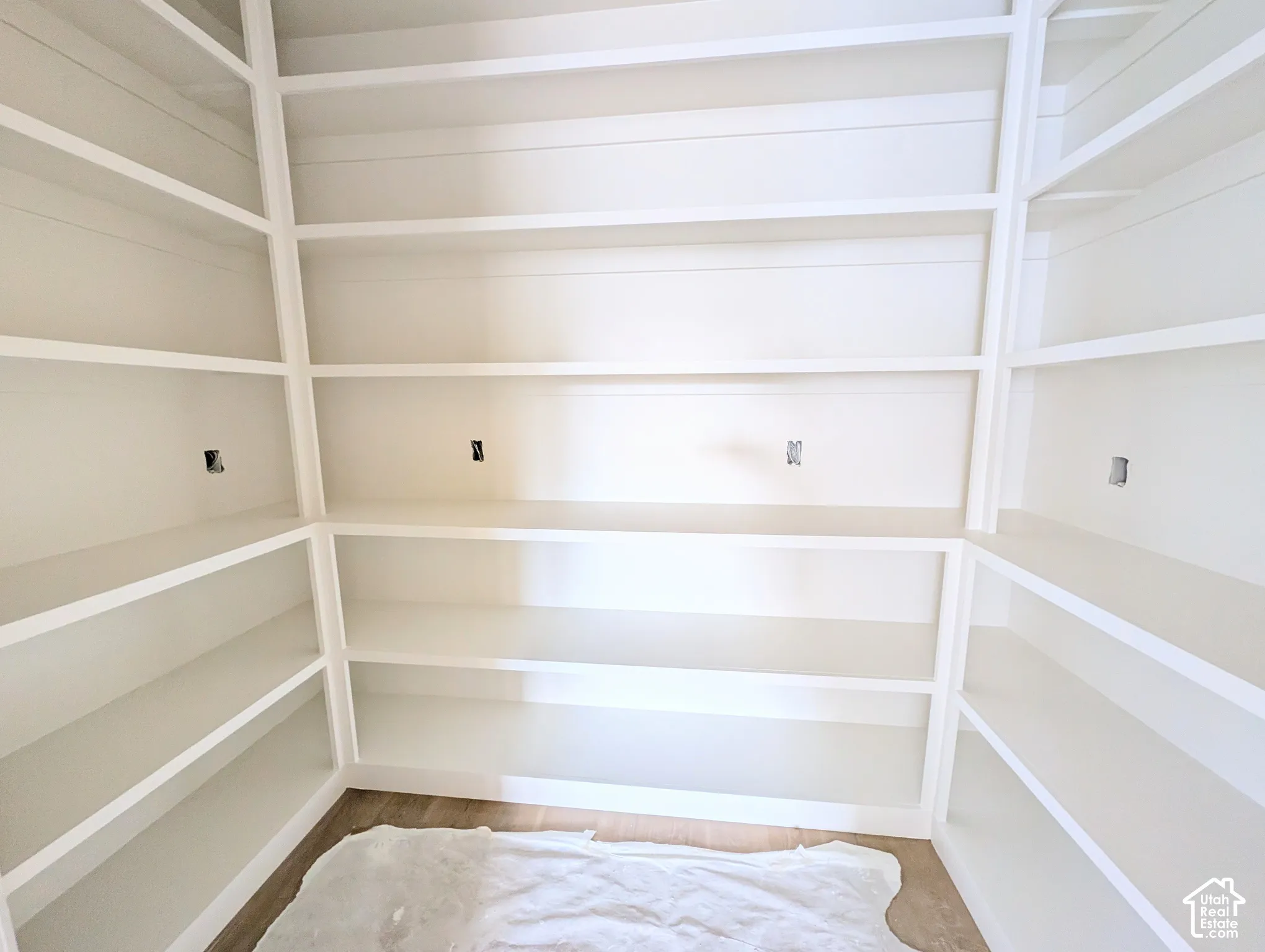 Extensive built-in shelving with a crisp white finish